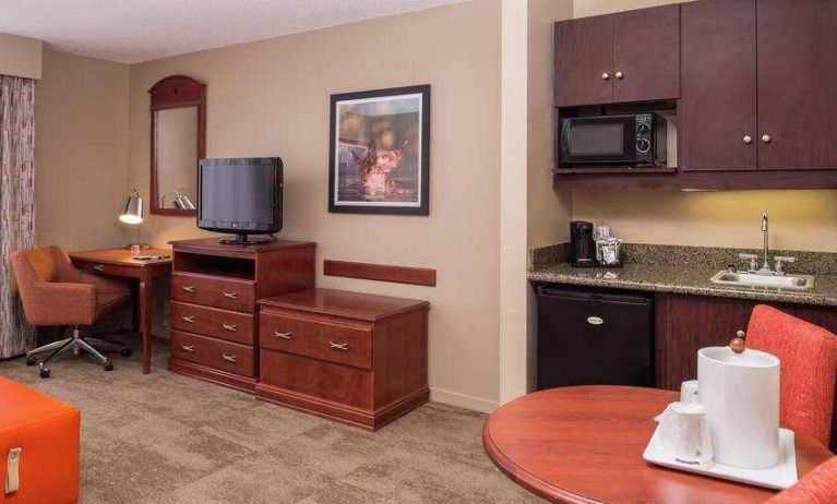 Comfortable and spacious living room with table and kitchenette at the Hampton Inn Columbia Northeast-Fort Jackson Area, SC.