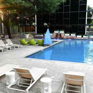 Relaxing outdoor pool area at the Hilton Dallas Lincoln Centre.