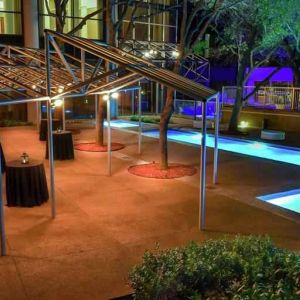 Beautiful pool area by night at the Hilton Dallas Lincoln Centre.