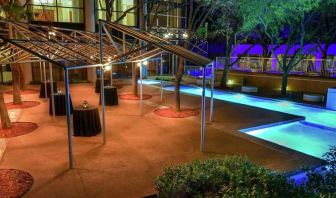 Beautiful pool area by night at the Hilton Dallas Lincoln Centre.