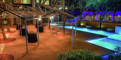 Beautiful pool area by night at the Hilton Dallas Lincoln Centre.