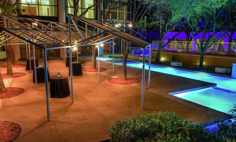 Beautiful pool area by night at the Hilton Dallas Lincoln Centre.