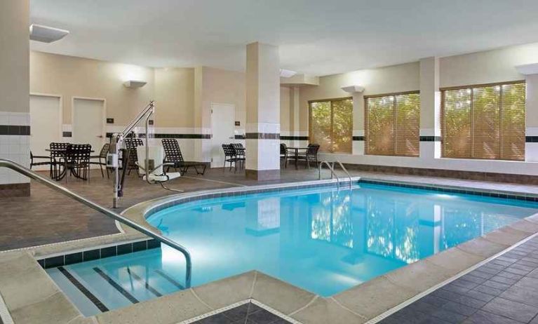 lovely indoor pool with seating area at Hilton Garden Inn Chicago/Midway Airport.