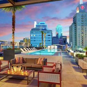 Stunning rooftop with pool and seating area perfect as workspace at the Statler Dallas, Curio Collection by Hilton.