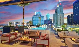 Stunning rooftop with pool and seating area perfect as workspace at the Statler Dallas, Curio Collection by Hilton.