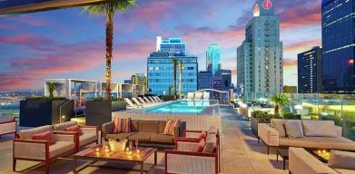 Stunning rooftop with pool and seating area perfect as workspace at the Statler Dallas, Curio Collection by Hilton.