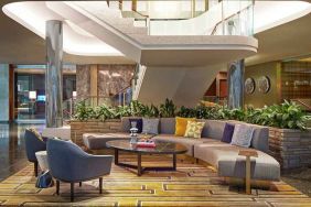 Elegant courtyard lobby perfect as workspace at the Statler Dallas, Curio Collection by Hilton.