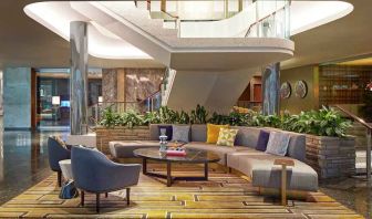 Elegant courtyard lobby perfect as workspace at the Statler Dallas, Curio Collection by Hilton.