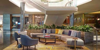 Elegant courtyard lobby perfect as workspace at the Statler Dallas, Curio Collection by Hilton.