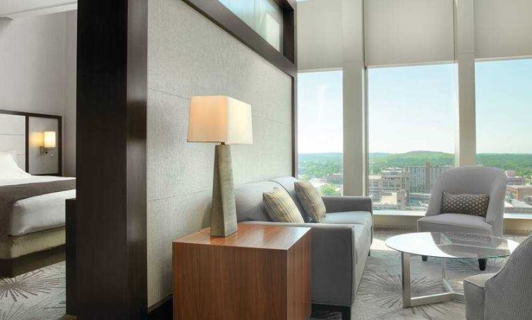 Spacious living room in a king suite room at the DoubleTree by Hilton Cedar Rapids Convention Complex.