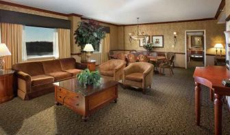 Spacious living room in a hotel suite at the DoubleTree by Hilton Lisle-Naperville.