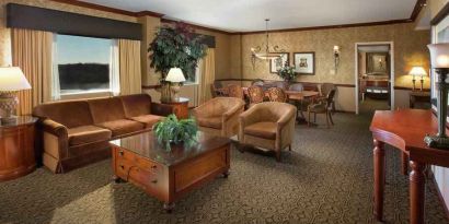 Spacious living room in a hotel suite at the DoubleTree by Hilton Lisle-Naperville.