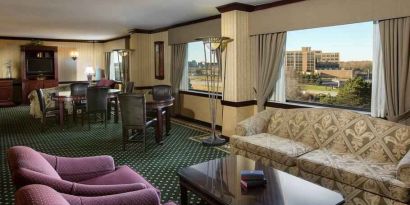 Comfortable seating lounge area with sofas and chairs at the DoubleTree by Hilton Lisle-Naperville.