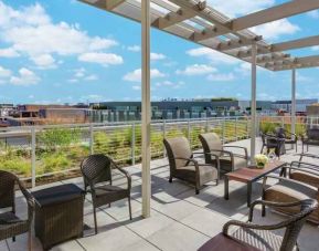 Beautiful rooftop with tables and chairs perfect as workspace at the Hampton Inn Washington-Downtown-Convention Center, DC.
