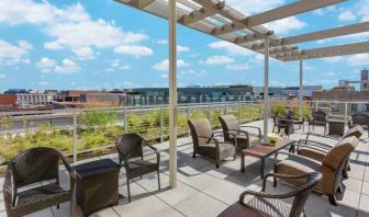 Beautiful rooftop with tables and chairs perfect as workspace at the Hampton Inn Washington-Downtown-Convention Center, DC.