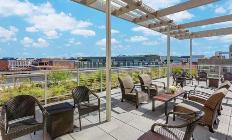 Beautiful rooftop with tables and chairs perfect as workspace at the Hampton Inn Washington-Downtown-Convention Center, DC.