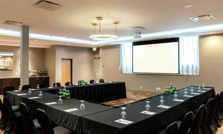 Large conference room with screen at the DoubleTree by Hilton Kitchener