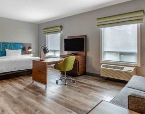 Spacious studio space with 1 king bed, desk, sofabed, couch and tv at the Hampton Inn & Suites by Hilton Edmont
