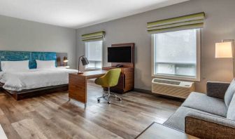 Spacious studio space with 1 king bed, desk, sofabed, couch and tv at the Hampton Inn & Suites by Hilton Edmont