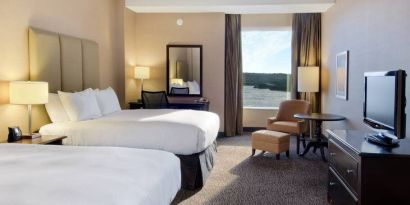 Spacious room with 2 queen beds, desk,chair and view of the harbour at the Hilton Saint John