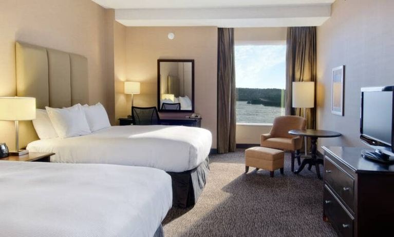 Spacious room with 2 queen beds, work desk and view of the harbour at the Hilton Saint John.