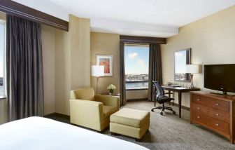 Day use room with work desk and lounge area at the Hilton Saint John.