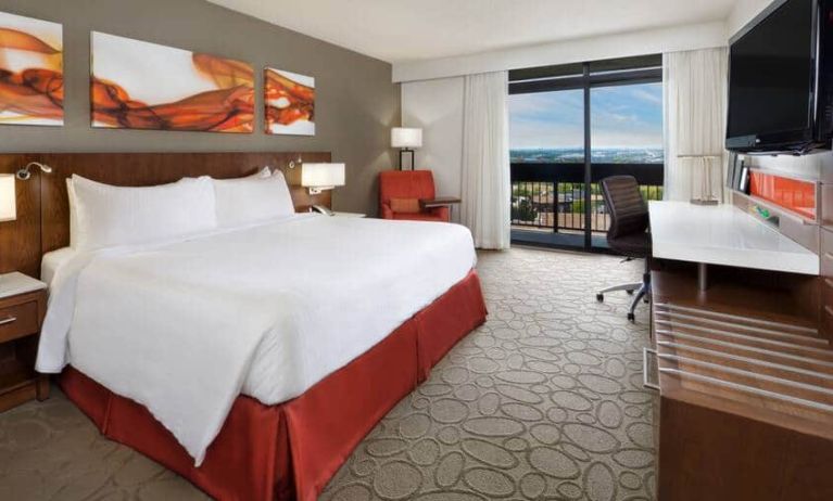 Bright and spacious day use room with view, work desk, sofa and private bathroom at Hilton Mississauga Meadowvale.