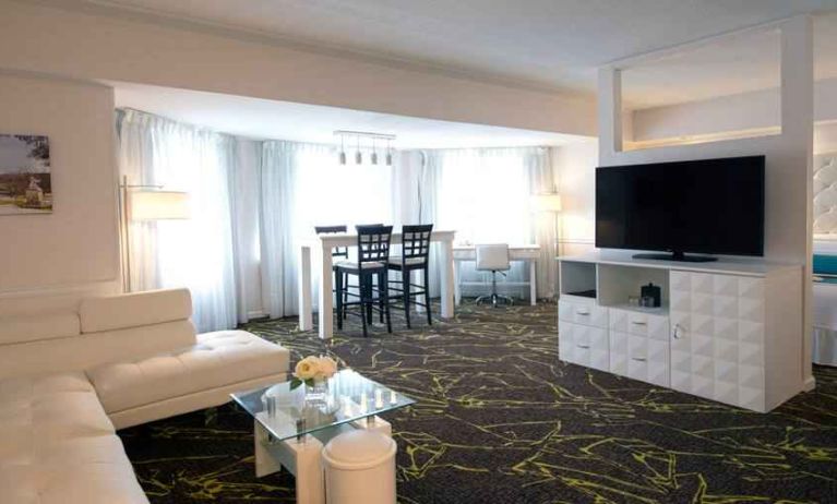 Spacious and comfortable living room in a king suite at the The Roslyn, Tapestry Collection by Hilton.