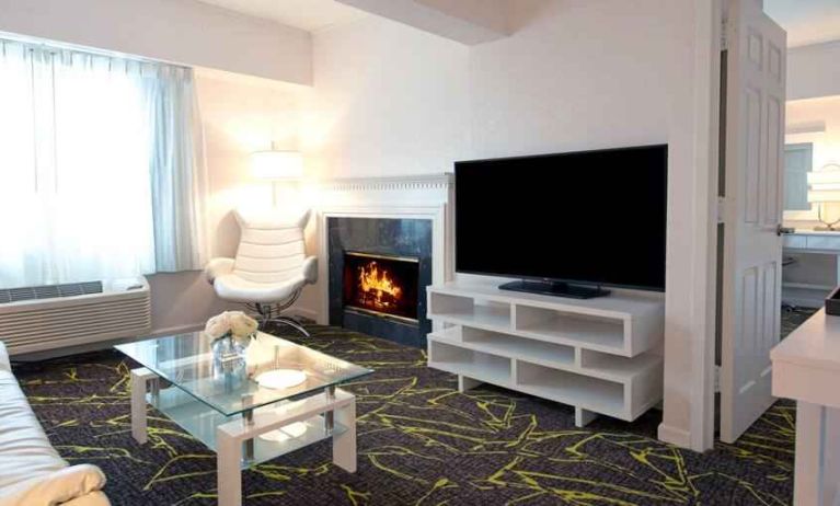 Beautiful hotel suite with fireplace at the The Roslyn, Tapestry Collection by Hilton.