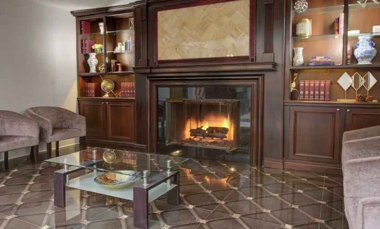 Beautiful library area with fireplace perfect as workspace at the The Roslyn, Tapestry Collection by Hilton.