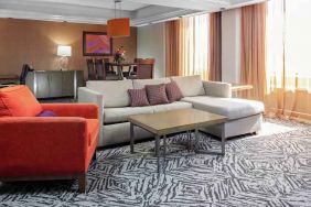 Spacious presidential suite with sofa and lunges at the DoubleTree by Hilton Omaha-Downtown.