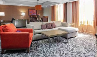 Spacious presidential suite with sofa and lunges at the DoubleTree by Hilton Omaha-Downtown.