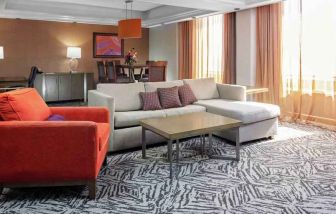 Spacious presidential suite with sofa and lunges at the DoubleTree by Hilton Omaha-Downtown.