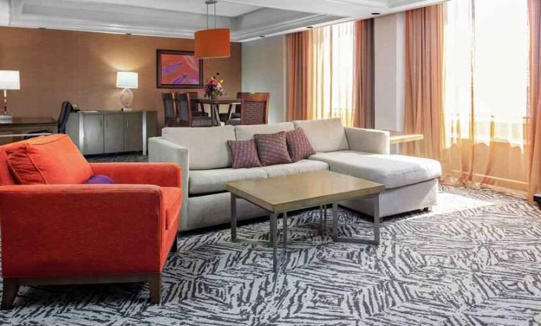 Spacious presidential suite with sofa and lunges at the DoubleTree by Hilton Omaha-Downtown.