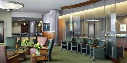 Beautiful lobby area with lounges and chairs perfect as workspace at the DoubleTree by Hilton Omaha-Downtown.