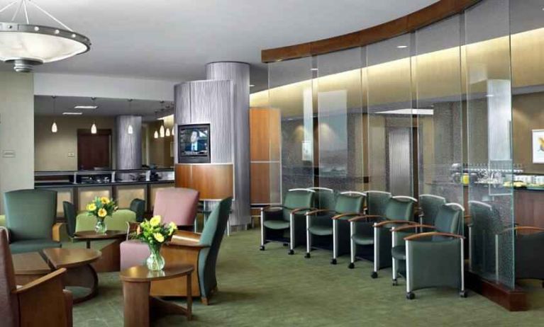 Beautiful lobby area with lounges and chairs perfect as workspace at the DoubleTree by Hilton Omaha-Downtown.