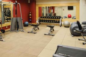 Fitness center with weights and machines at the DoubleTree by Hilton Omaha-Downtown.