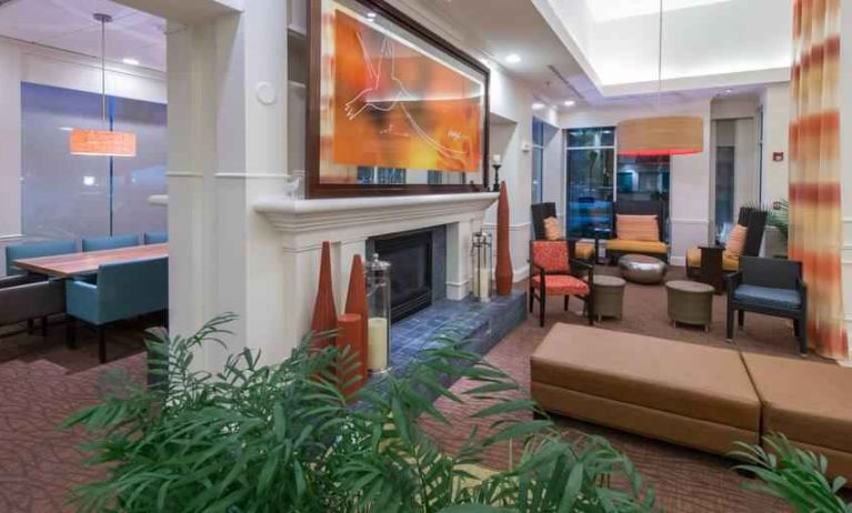 Elegant lobby area with fireplace perfect as workspace at the Hilton Garden Inn Tallahassee Central.