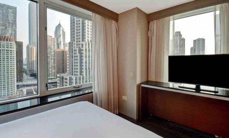 King guestroom with city view at the Embassy Suites by Hilton Chicago Magnificent Mile.