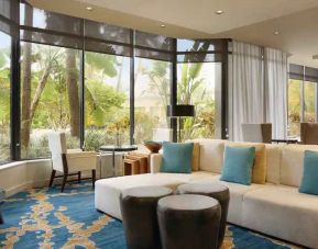 Bright workspace with lounges and chairs at the Hilton Miami Airport Blue Lagoon.