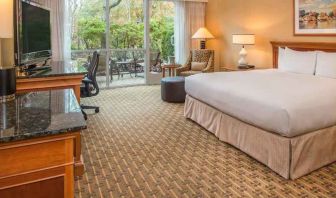 Spacious and comfortable king suite with balcony at the Hilton Seattle Airport & Conference Center.