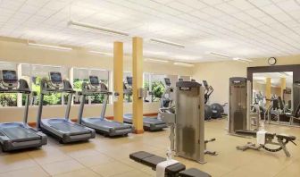 Fitness center with treadmills and machines at the Hilton Seattle Airport & Conference Center.