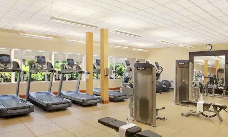 Fitness center with treadmills and machines at the Hilton Seattle Airport & Conference Center.