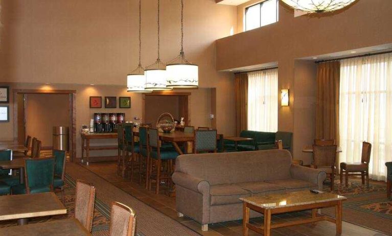 Comfortable lobby area perfect as workplace at the Hampton Inn & Suites Riverton, WY.