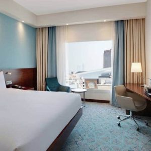 King suite with queen bed, desk, tv, wifi and other amenities at the Hampton by Hilton Dubai al Barsha