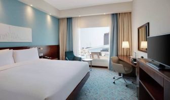 King suite with queen bed, desk, tv, wifi and other amenities at the Hampton by Hilton Dubai al Barsha