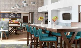 bright-lit, comfortable lobby-lounge and coworking space at Hampton Inn & Suites Sunnyvale Silicon Valley.