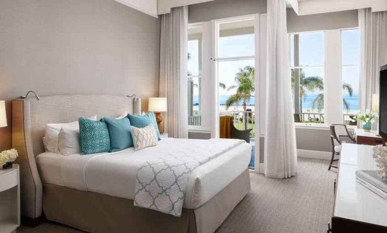 Bright king bedroom with ocean view at the Hotel del Coronado, Curio Collection by Hilton.