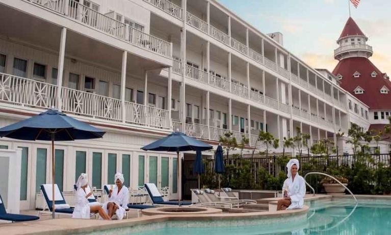 Relaxing area with pool and lounges at the Hotel del Coronado, Curio Collection by Hilton.