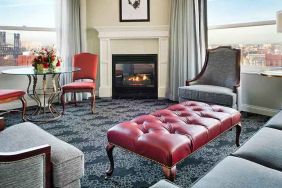 Bright and comfortable presidential suite with sofas and fireplace at the Embassy Suites by Hilton Portland-Downtown.